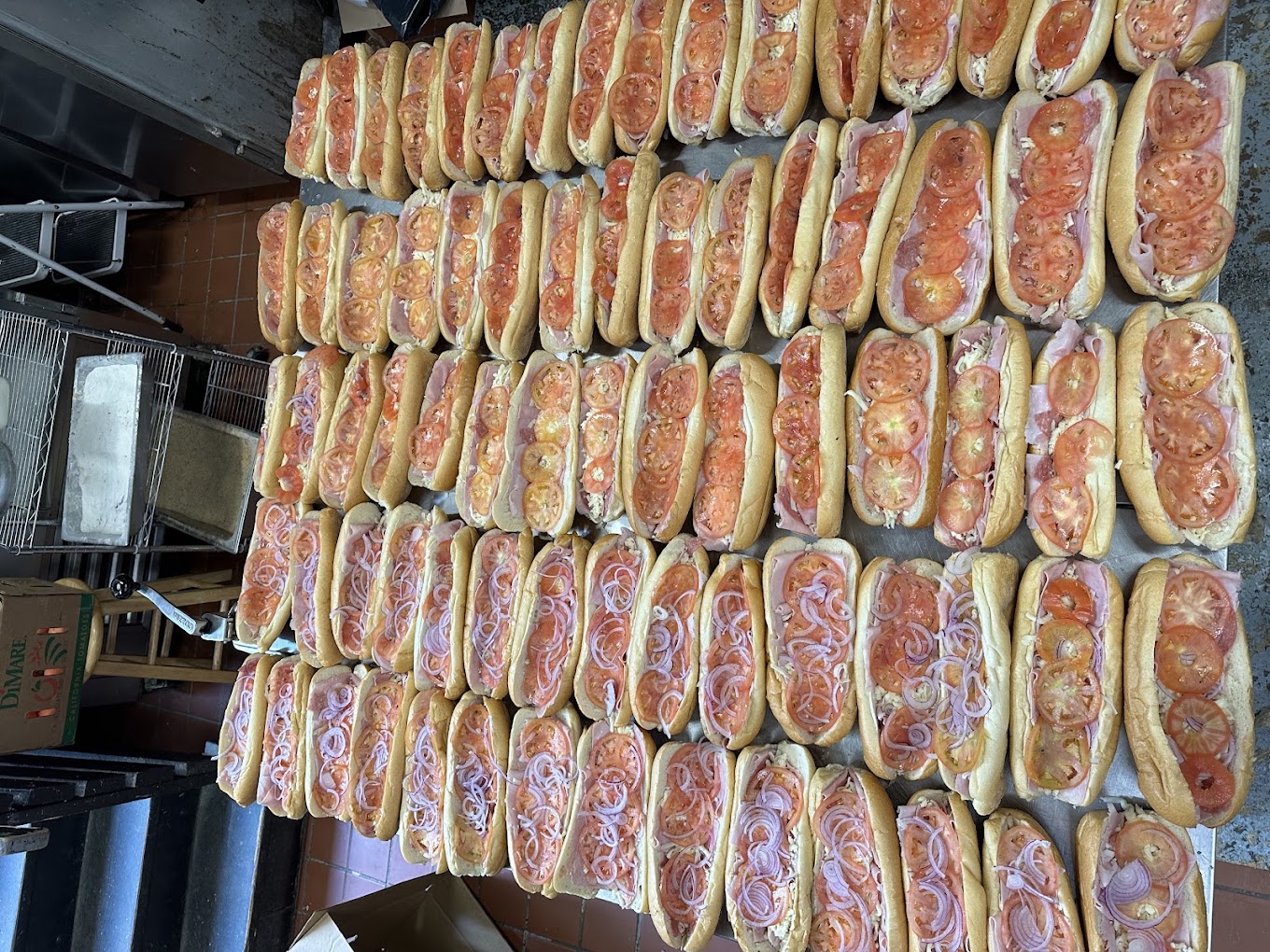 Catering subs prepared at Delizia's Pizza